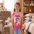 T-shirt fille rose dégradé avec licorne blanche et notes de musique, porté par une enfant