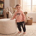 Ensemble bébé fille porté, haut rose pêche à volant et inscription avec yeux, pantalon noir LOOK