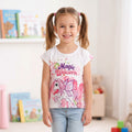 T-shirt fille blanc et rose Magic Unicorn à motif licorne ailée, porté par une enfant